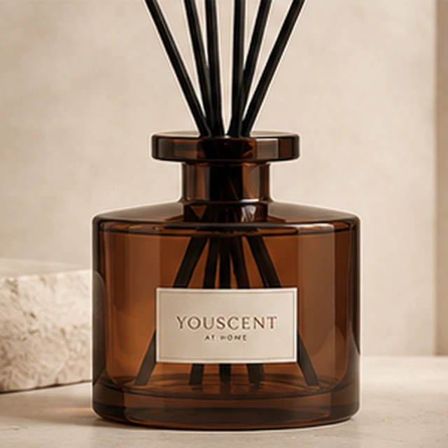 The Amber reed diffuser, rich cognac glass. a bold, clean shape. Label saying Made yours.